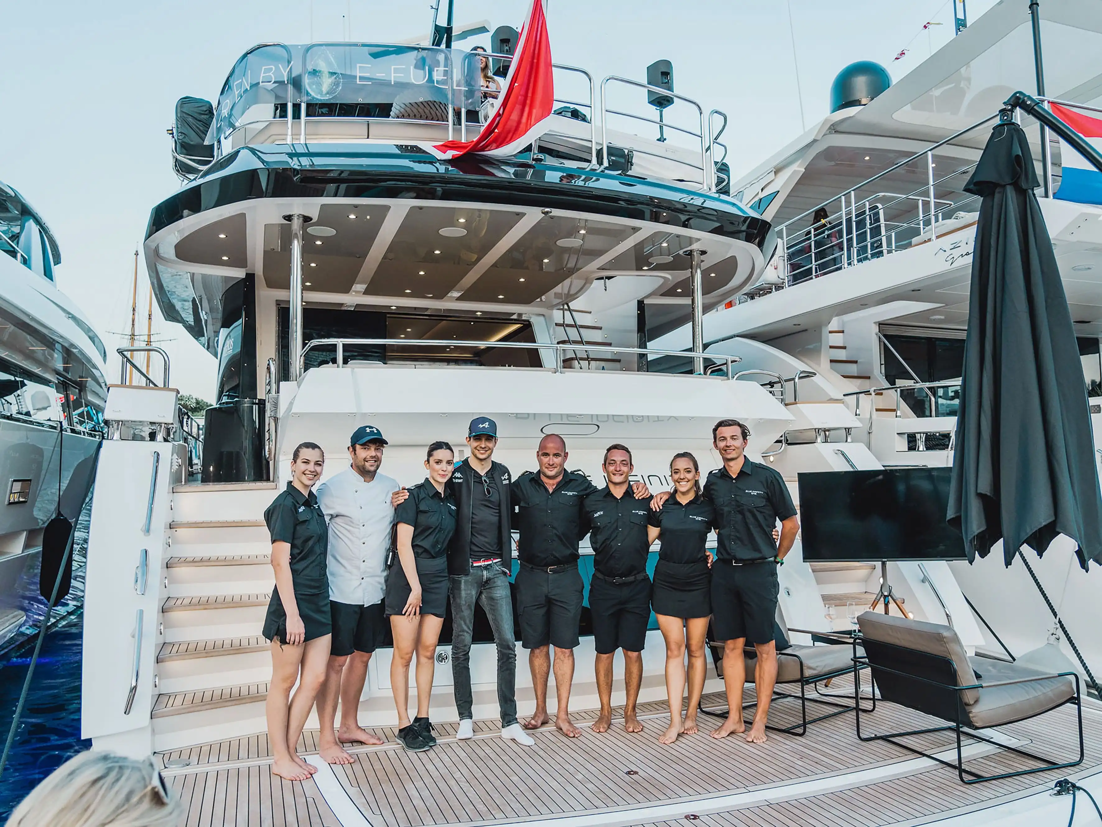 meros crew in front of the yacht